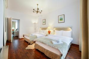 Posteľ alebo postele v izbe v ubytovaní Apartamenty Łozówka