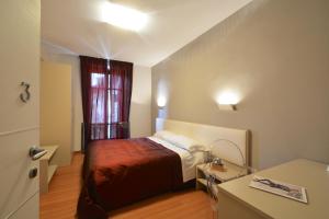 Postel nebo postele na pokoji v ubytování Matteotti25