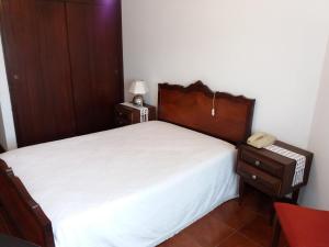 Voodi või voodid majutusasutuse Pensão São Jorge toas
