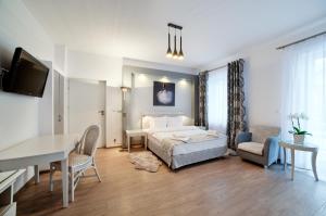 Posteľ alebo postele v izbe v ubytovaní Apartamenty Łozówka