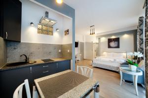 Posteľ alebo postele v izbe v ubytovaní Apartamenty Łozówka