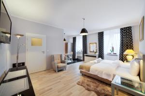 Posteľ alebo postele v izbe v ubytovaní Apartamenty Łozówka