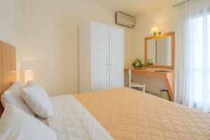 Кровать или кровати в номере Mare Hotel Apartments