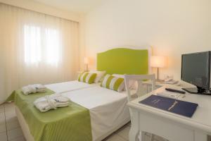 Кровать или кровати в номере Mare Hotel Apartments