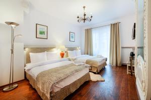 Posteľ alebo postele v izbe v ubytovaní Apartamenty Łozówka