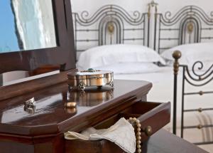 Postel nebo postele na pokoji v ubytování Villa Oriana Relais