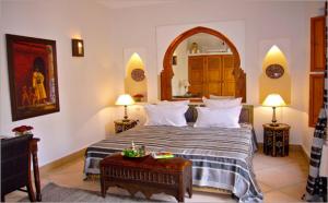 Ein Bett oder Betten in einem Zimmer der Unterkunft Riad Rabahsadia