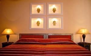 Ein Bett oder Betten in einem Zimmer der Unterkunft Riad Rabahsadia