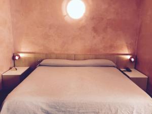 Postel nebo postele na pokoji v ubytování Hotel 2 Magnolie