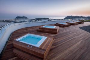 a hot tub on the deck of a cruise ship at Hotel bridge Seogwipo in Seogwipo