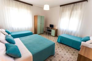Posteľ alebo postele v izbe v ubytovaní Hotel Antagos