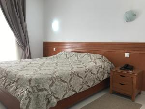 Postel nebo postele na pokoji v ubytování Hotel AL KARMEL + 36 fotografií