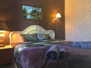 a bedroom with a bed with a hello kitty comforter at Prenzel Apartments in Pärnu