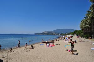 a group of people on a beach in the water at Bandirma Saglik Apart in Bandırma