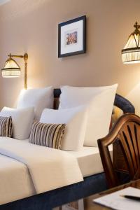 a living room with a couch and pillows at Hotel Barsey by Warwick in Brussels