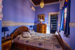 Ліжко або ліжка в номері Riad Fes Baraka