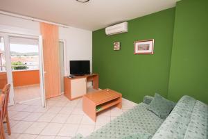 Televízia a/alebo spoločenská miestnosť v ubytovaní Apartments Spirito