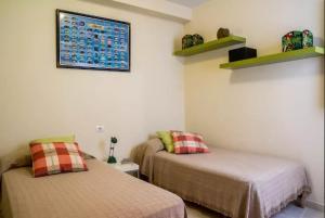 A bed or beds in a room at Crucero vista al mar A