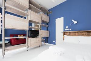 A bed or beds in a room at Heart Milan Apartments Duomo SanBarnaba