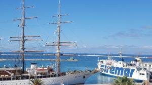 a large ship is docked in the water at Alla Marina Bed And Breakfast in Trapani