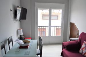 Televízia a/alebo spoločenská miestnosť v ubytovaní Apartamento Prado - Casa Eva