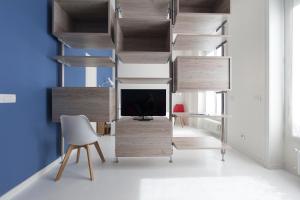 A television and/or entertainment centre at Heart Milan Apartments Duomo SanBarnaba