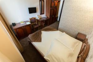 an overhead view of a bedroom with a bed and a desk at Express Residence in Brăila