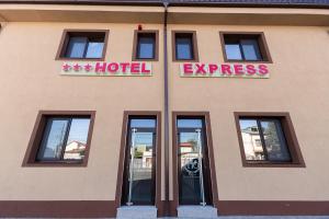 a hotel with a sign on the side of a building at Express Residence in Brăila