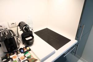 A kitchen or kitchenette at Heart Milan Apartments Duomo SanBarnaba