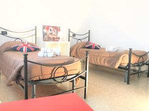 Łóżko lub łóżka w pokoju w obiekcie Chianciano Lettings
