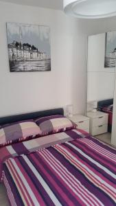Katil atau katil-katil dalam bilik di Apartments Villa Nona II