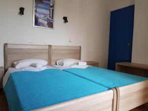 Postel nebo postele na pokoji v ubytování Sparta Team Hotel
