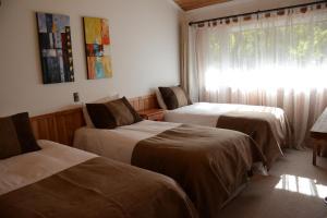 Postelja oz. postelje v sobi nastanitve Hotel y Cabañas Borde Andino
