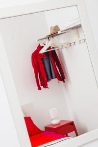 a closet with a red shelf and a red stool at Gennadi Holiday Home in Gennadi
