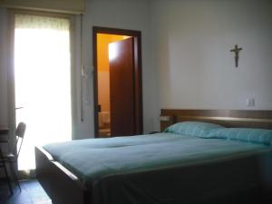 Postel nebo postele na pokoji v ubytování Hotel Bellevue