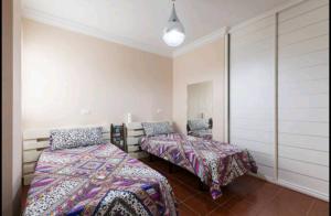 Posteľ alebo postele v izbe v ubytovaní Sky House