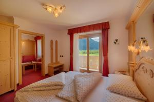 Postel nebo postele na pokoji v ubytování Hotel Mair