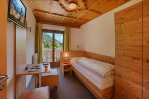 Postel nebo postele na pokoji v ubytování Hotel Mair
