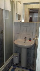 a bathroom with a sink and a shower at Rooms Katija in Mali Ston