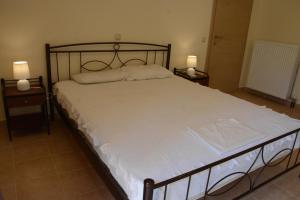 Ένα ή περισσότερα κρεβάτια σε δωμάτιο στο Christina 's House