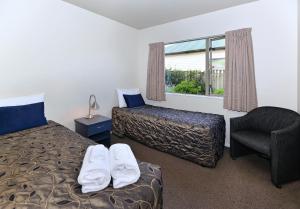 Postel nebo postele na pokoji v ubytování Arena Motel