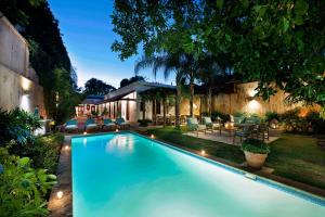 a swimming pool in the backyard of a house at Casas del XVI in Santo Domingo
