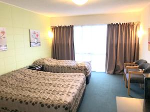 Postel nebo postele na pokoji v ubytování Greenview Motel