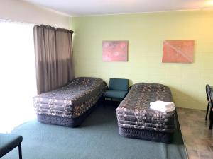 Postel nebo postele na pokoji v ubytování Greenview Motel