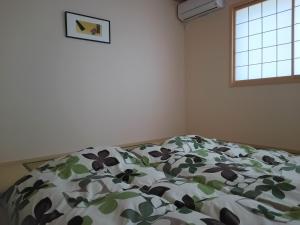 Katil atau katil-katil dalam bilik di Guest House Aoi Nakamoto +31 gambar