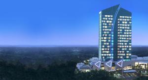 卡拉旺的住宿－瑞信達卡拉旺酒店，一座高大的建筑,毗邻一座大建筑