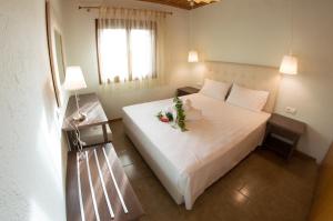 Postel nebo postele na pokoji v ubytování Aegialis Apartments (Dimitros)