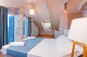Postel nebo postele na pokoji v ubytování Blue Sea Cottage
