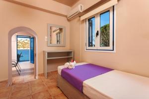 Posteľ alebo postele v izbe v ubytovaní Blue Sea Cottage