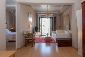 a living room with a couch and a table at Spolia Art Maison in Chania Town